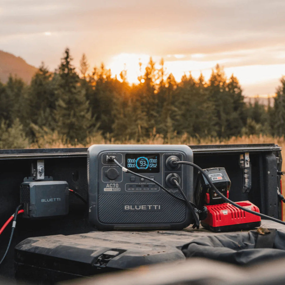BLUETTI charger 1 power station charger battery system in a truck bed with a scenic background
