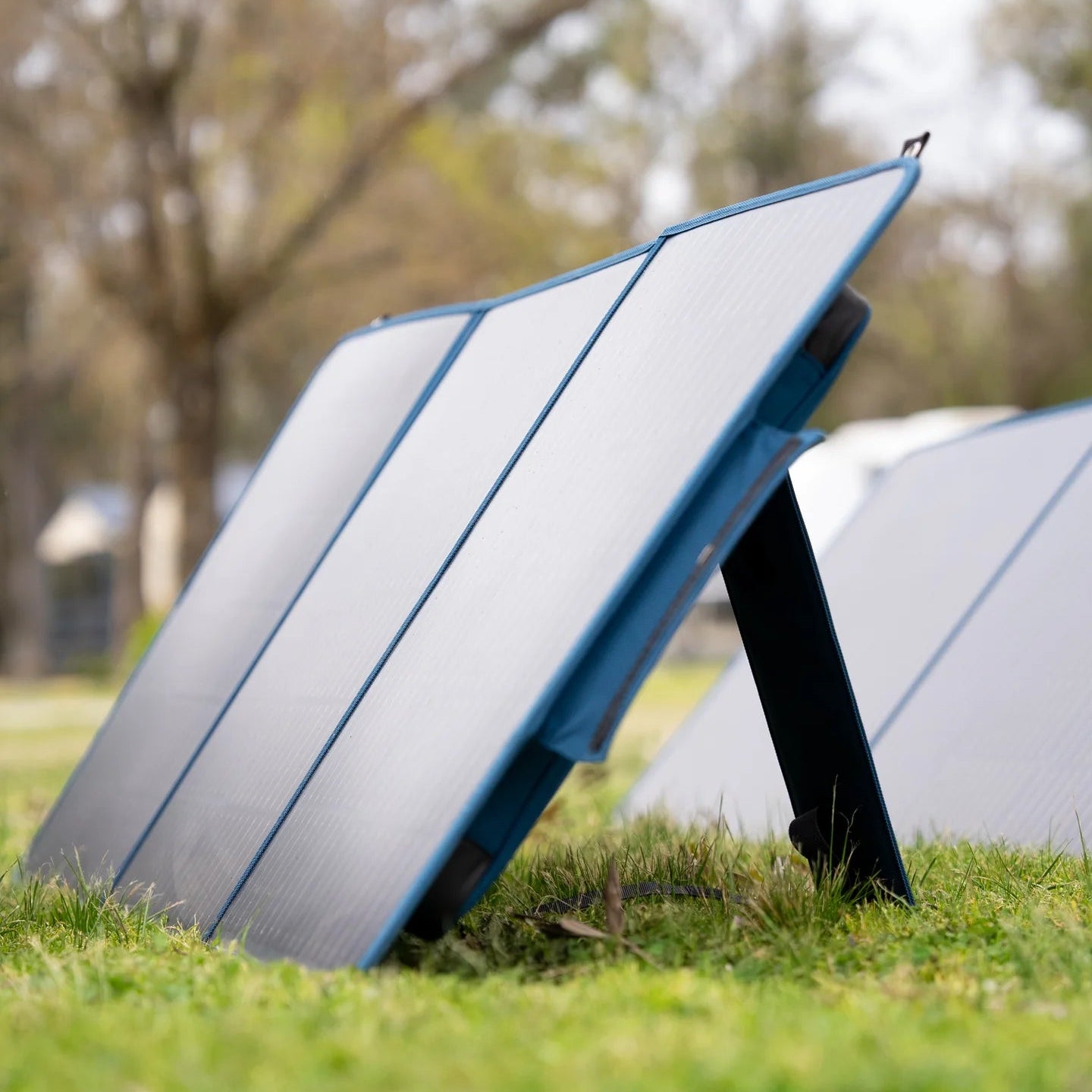 A photo of a MyCOOLMAN 100W Flexible Solar Blanket on grass