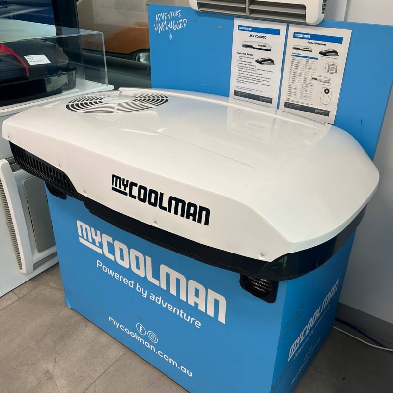 A Photo of a white MyCOOLMAN Roof Mounted Air Conditioner in a showroom.