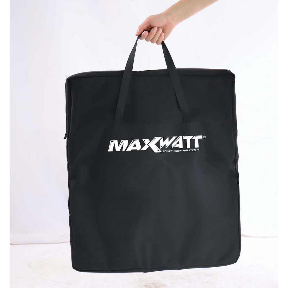 100W Maxwatt Solar Blanket carry bag with hand on a white background