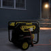 12.5 kVA Petrol Generator in a dark setting with the light in the background