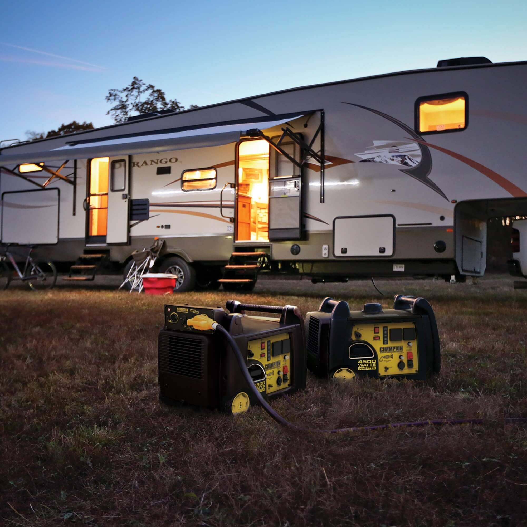 4500W generator powering a travel trailer at a campsite in the evening 