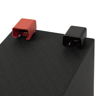A photo showing the red and black terminals of a custom lithium 310ah compact lithium battery.