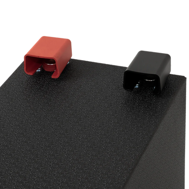 A photo showing the red and black terminals of a custom lithium 310ah compact lithium battery.
