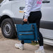 In the photo a Man or woman carrying a MyCOOLMAN 100W Portable Solar Blanket 