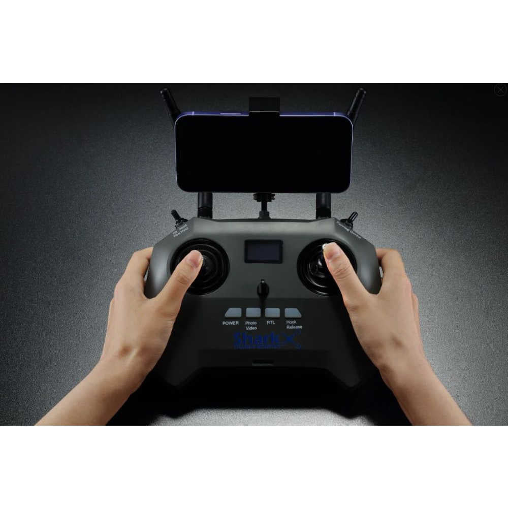 Man hands holding SharkX Drone remote 