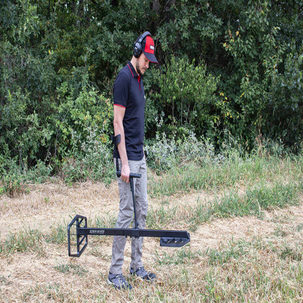 XTREM hunter metal detector in use by a man
