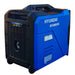 Rear three-quarter view of the Hyundai HY5000iSE inverter generator showing the ventilated rear panel, warning labels and rear wheels.