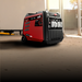 A photo of an iTechWorld Redback 6.5kW portable inverter generator sitting on the floor.
