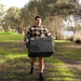 Man Carrying a iTechWorld iFrost 40L Portable Camping Fridge/Freezer in an outdoor setting