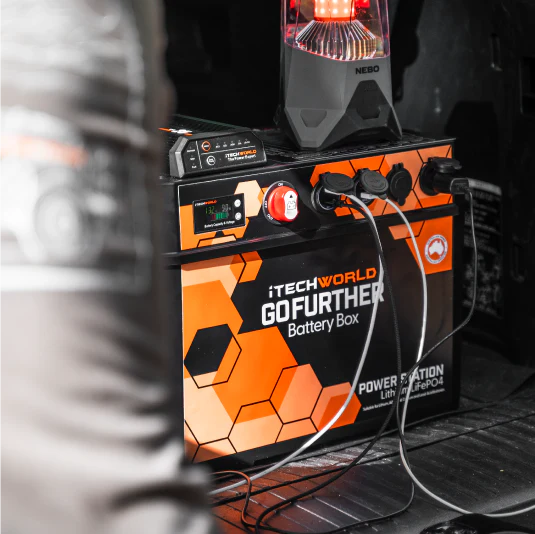 A photo of an iTechWorld GoFurther Battery Box charging various items.