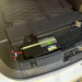 Custom Lithium dual battery installed under the rear floor of an Isuzu MU-X with the cargo liner lifted and the battery terminals connected.
