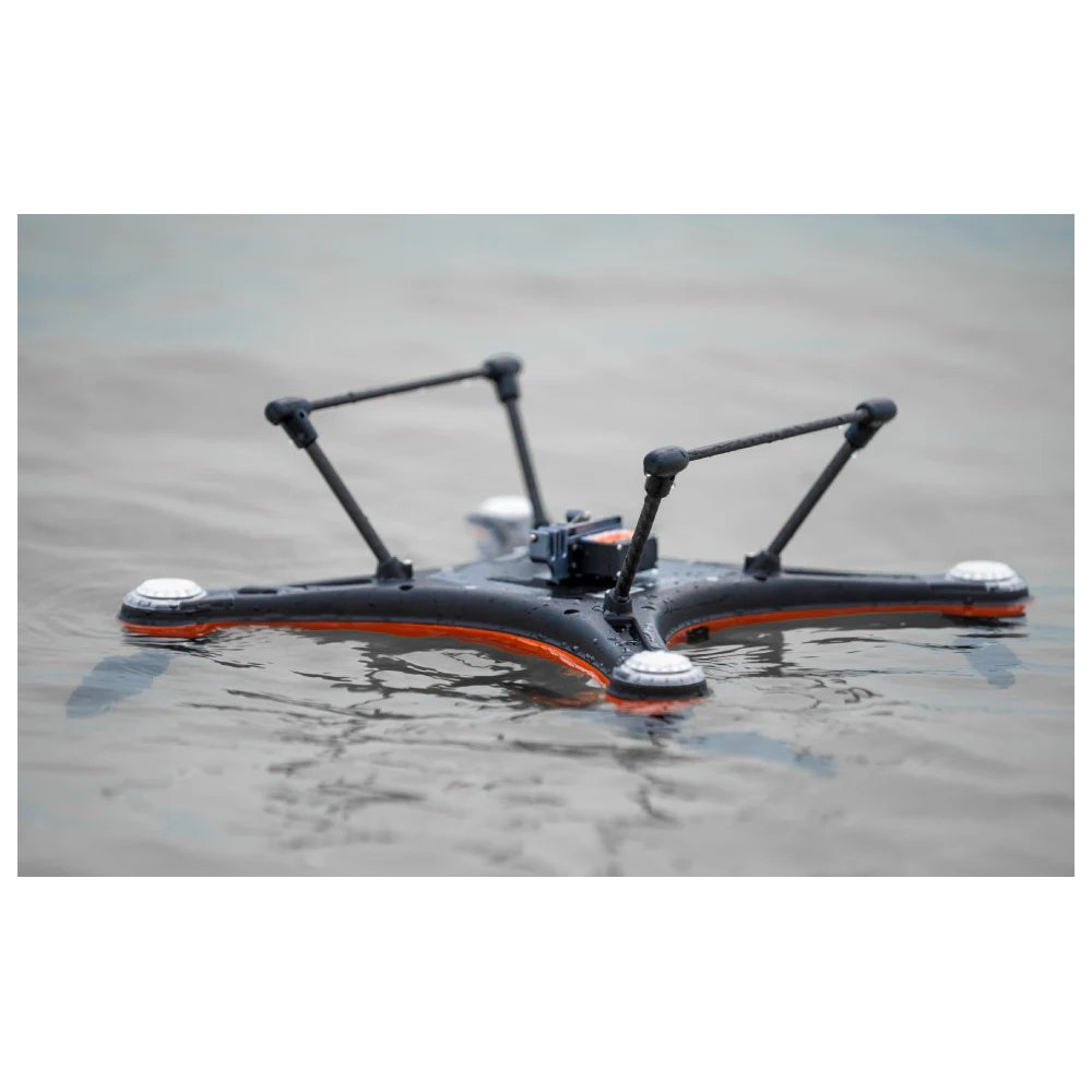 SwellPro Fisherman FD1S fishing drone floating upside down on calm water, showing the buoyant self-righting airframe.
