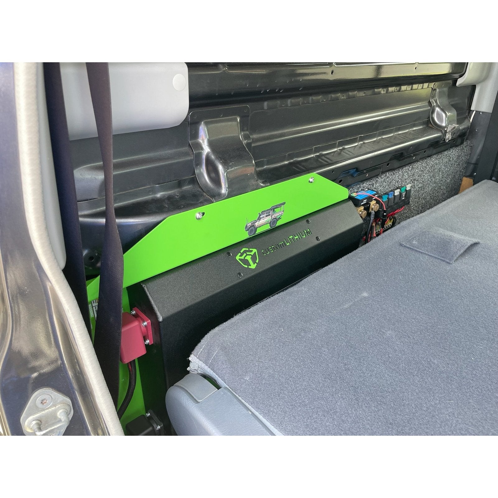 Custom Lithium 79 Series dual battery fitted along the rear wall behind the seats of a LandCruiser dual cab.