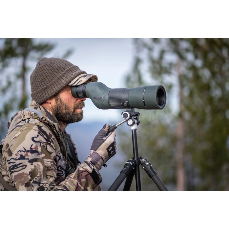Hunter glassing with the Viper 15-45x65 Straight Scope mounted on a tripod, tripod sold separately