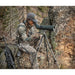 Hunter seated on a rocky hillside glassing with the Viper 20-60x85 Angled Scope on a tripod, tripod sold separately